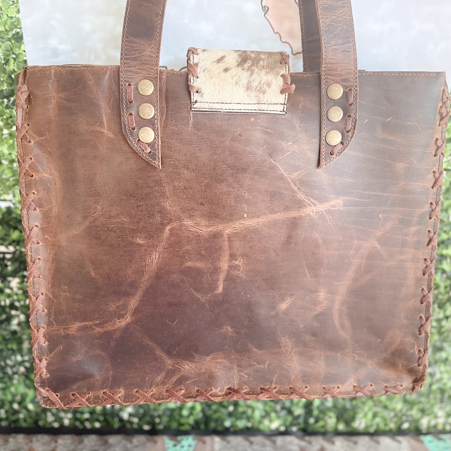 Palomino Bluff tote in hair-on cowhide and brown crunch leather with turquoise concho