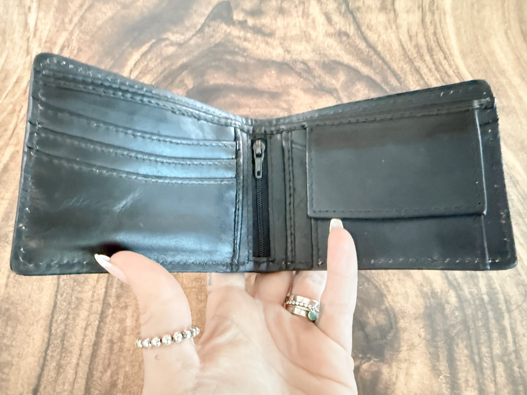 Interior view of men’s bifold wallet with card slots, zipper pocket, and coin pouch