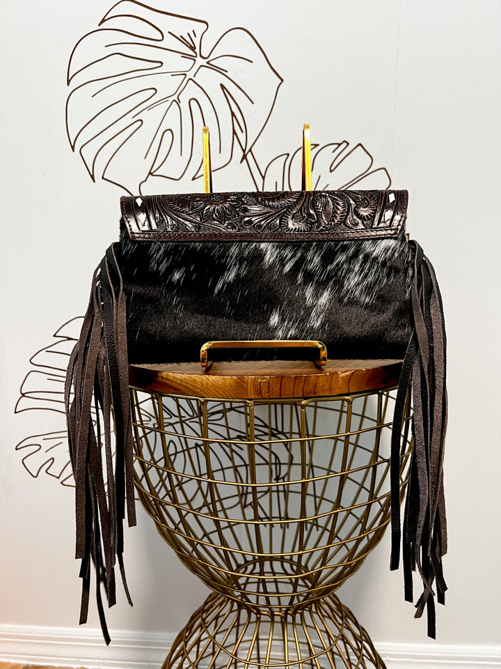 Fancy Seeing you Here: Tooled Brown Leather and Black Cowhide Hand Clutch