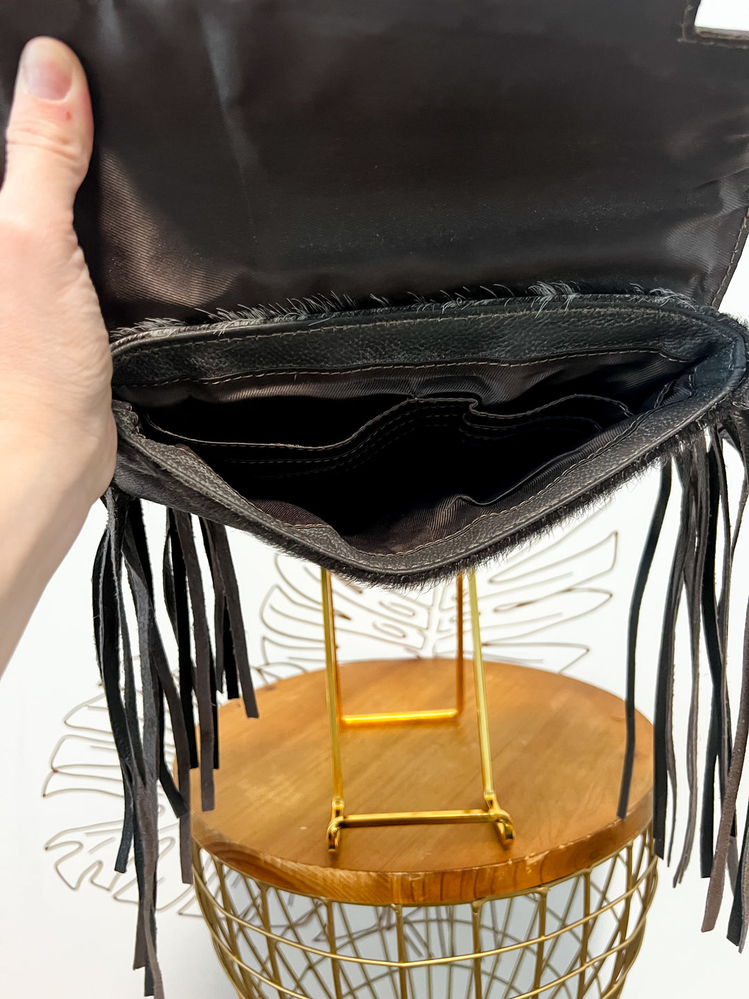 Fancy Seeing you Here: Tooled Brown Leather and Black Cowhide Hand Clutch
