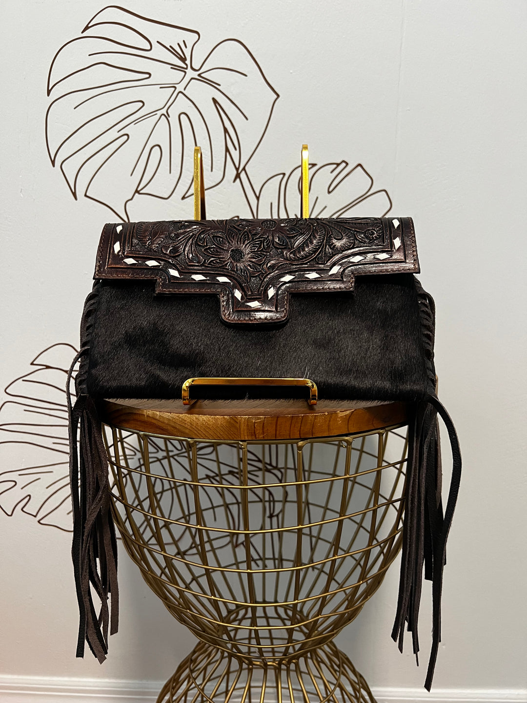 Fancy Seeing you Here: Tooled Brown Leather and Black Cowhide Hand Clutch