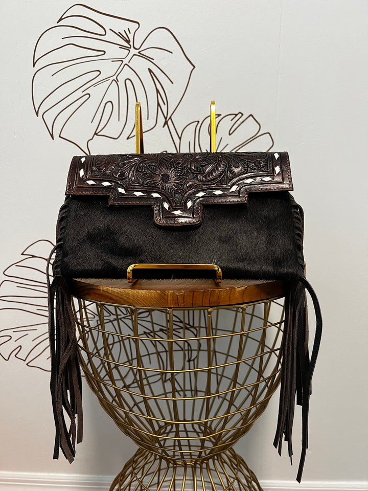 Fancy Seeing you Here: Tooled Brown Leather and Black Cowhide Hand Clutch