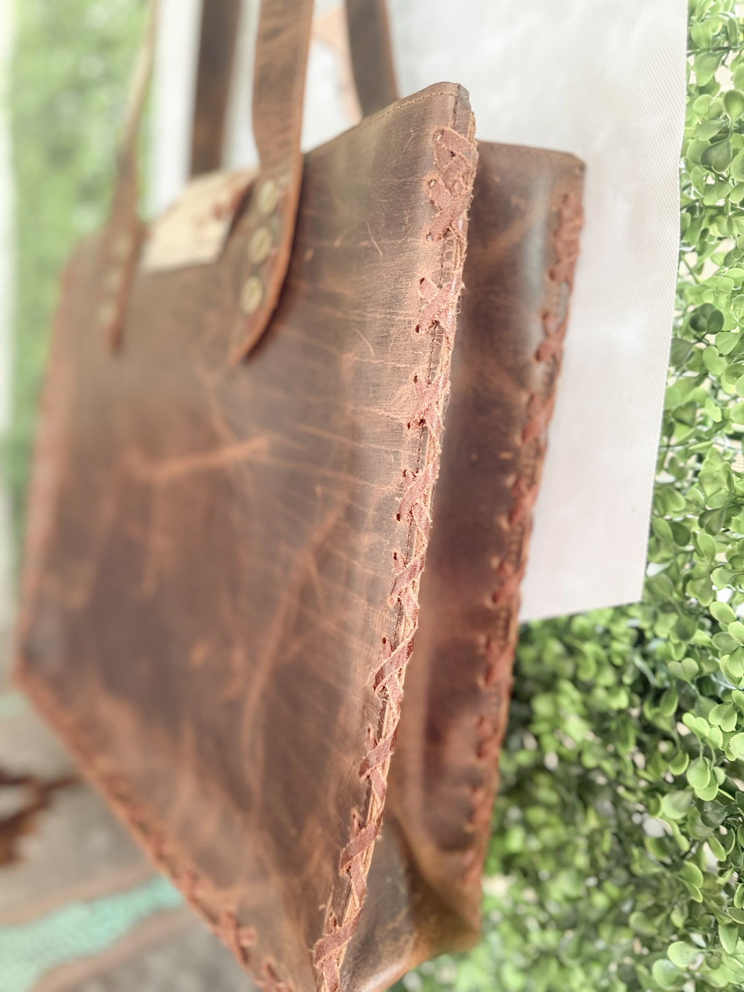 Palomino Bluff tote in hair-on cowhide and brown crunch leather with turquoise concho