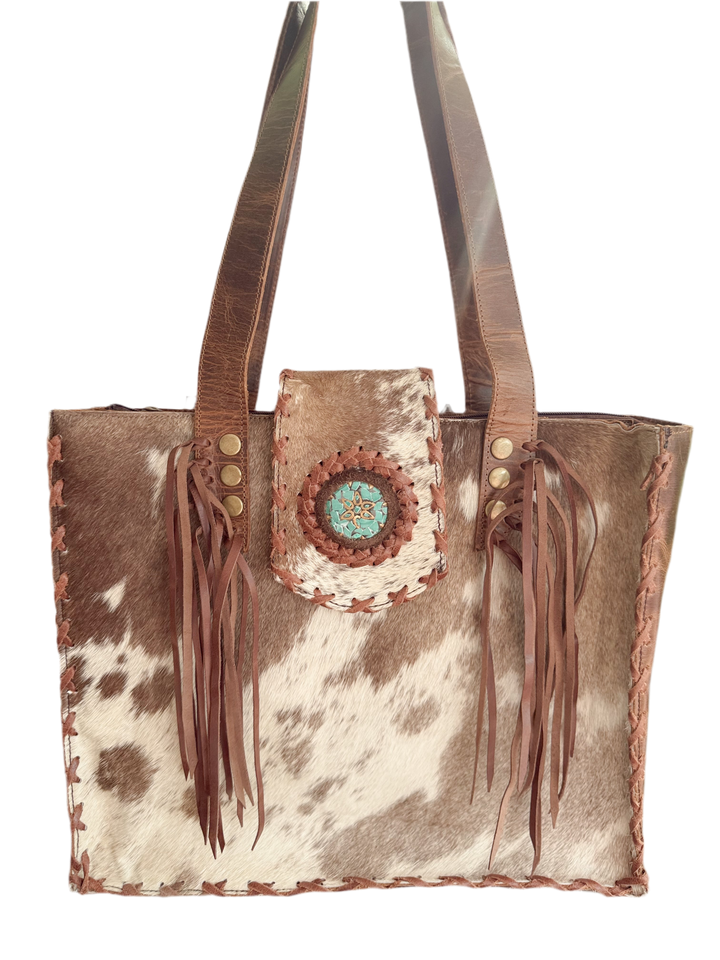 Palomino Bluff tote in hair-on cowhide and brown crunch leather with turquoise concho