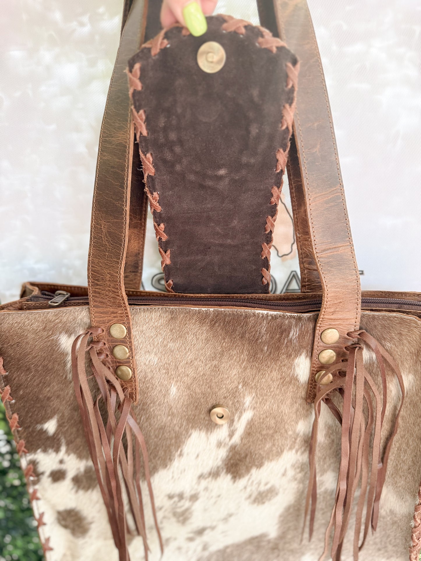 Palomino Bluff tote in hair-on cowhide and brown crunch leather with turquoise concho