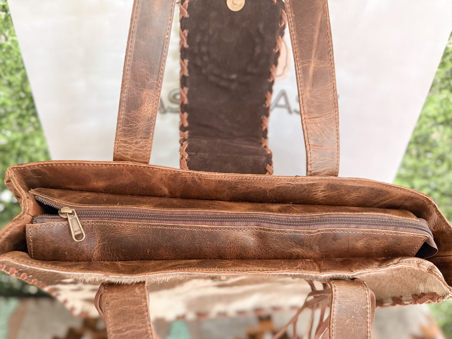 Palomino Bluff tote in hair-on cowhide and brown crunch leather with turquoise concho