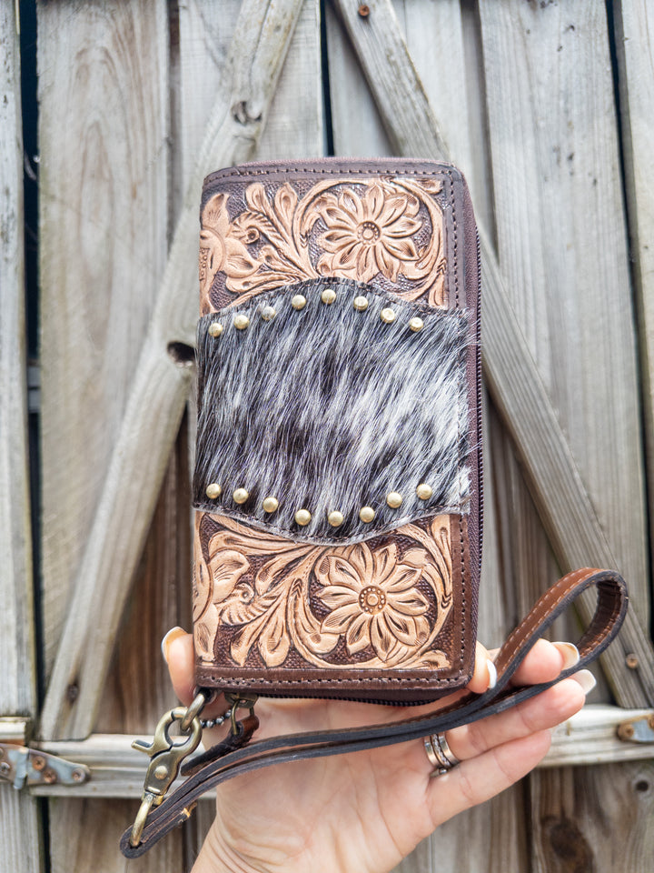 Rear view of Family Tradition women’s western leather and hair on cowhide wallet with gold studs