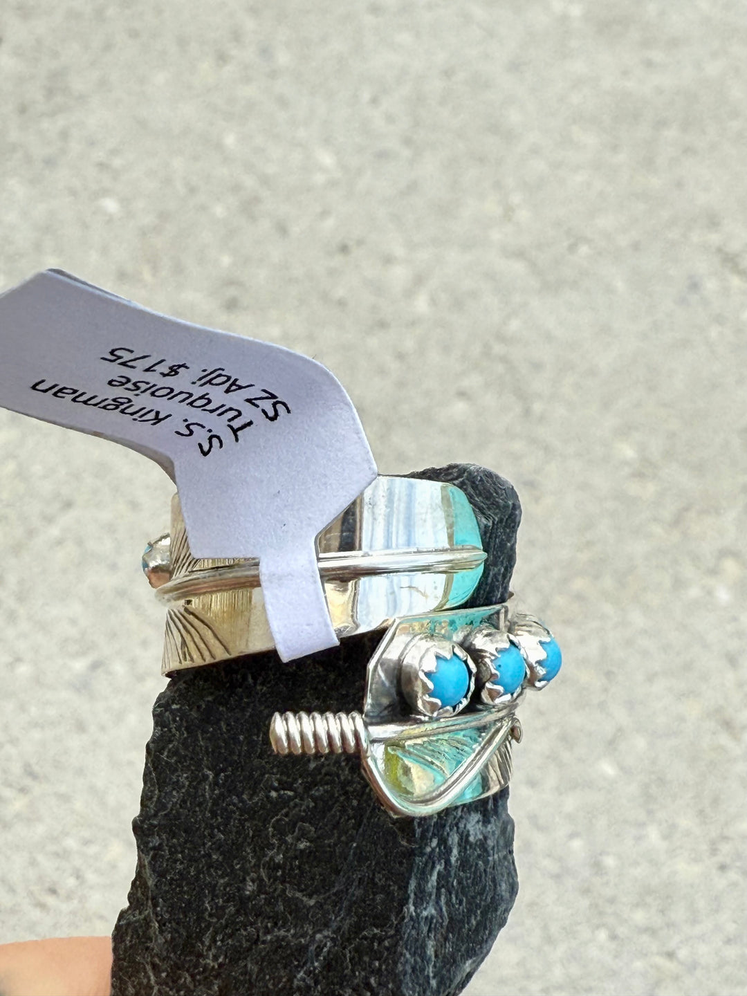 Front of the Sterling silver bypass feather Kingman Turquoise ring handmade by Navajo Chester Charley