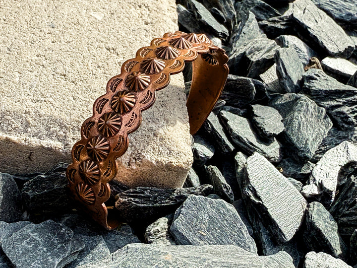 Vintage Bell Trading Post copper cuff bracelet with scalloped concho stampwork and warm aged patina