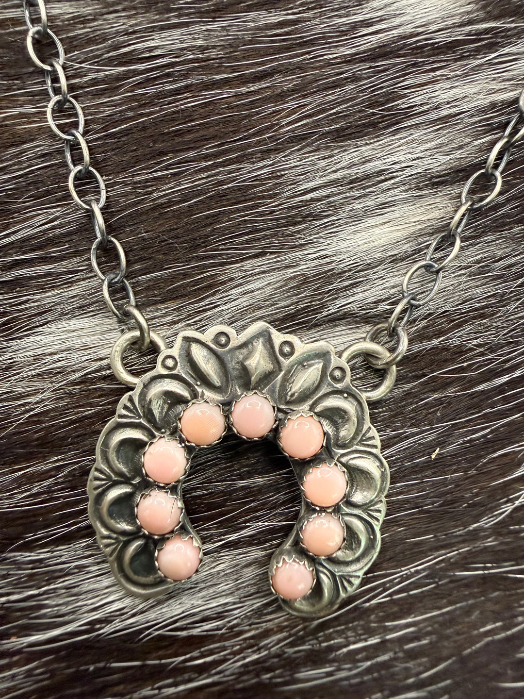 Handmade Navajo sterling silver naja necklace with pink conch stones signed by Native American artist R Livingston