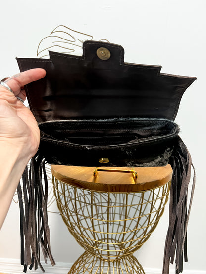 Fancy Seeing you Here: Tooled Brown Leather and Black Cowhide Hand Clutch
