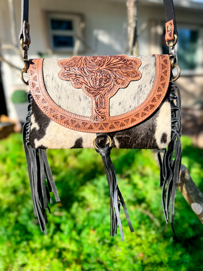 A touch of fringe front tooled cowhide crossbody