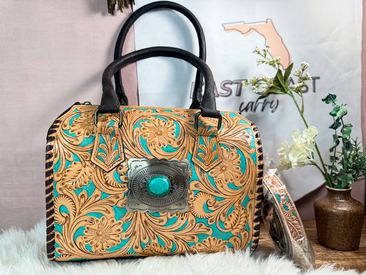 Tooled leather turquoise speedy satchel handbag with black handles and concho detail