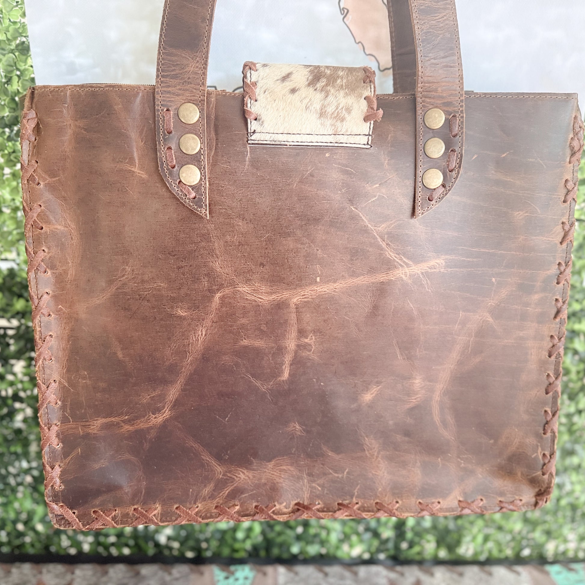Palomino Bluff tote in hair-on cowhide and brown crunch leather with turquoise concho