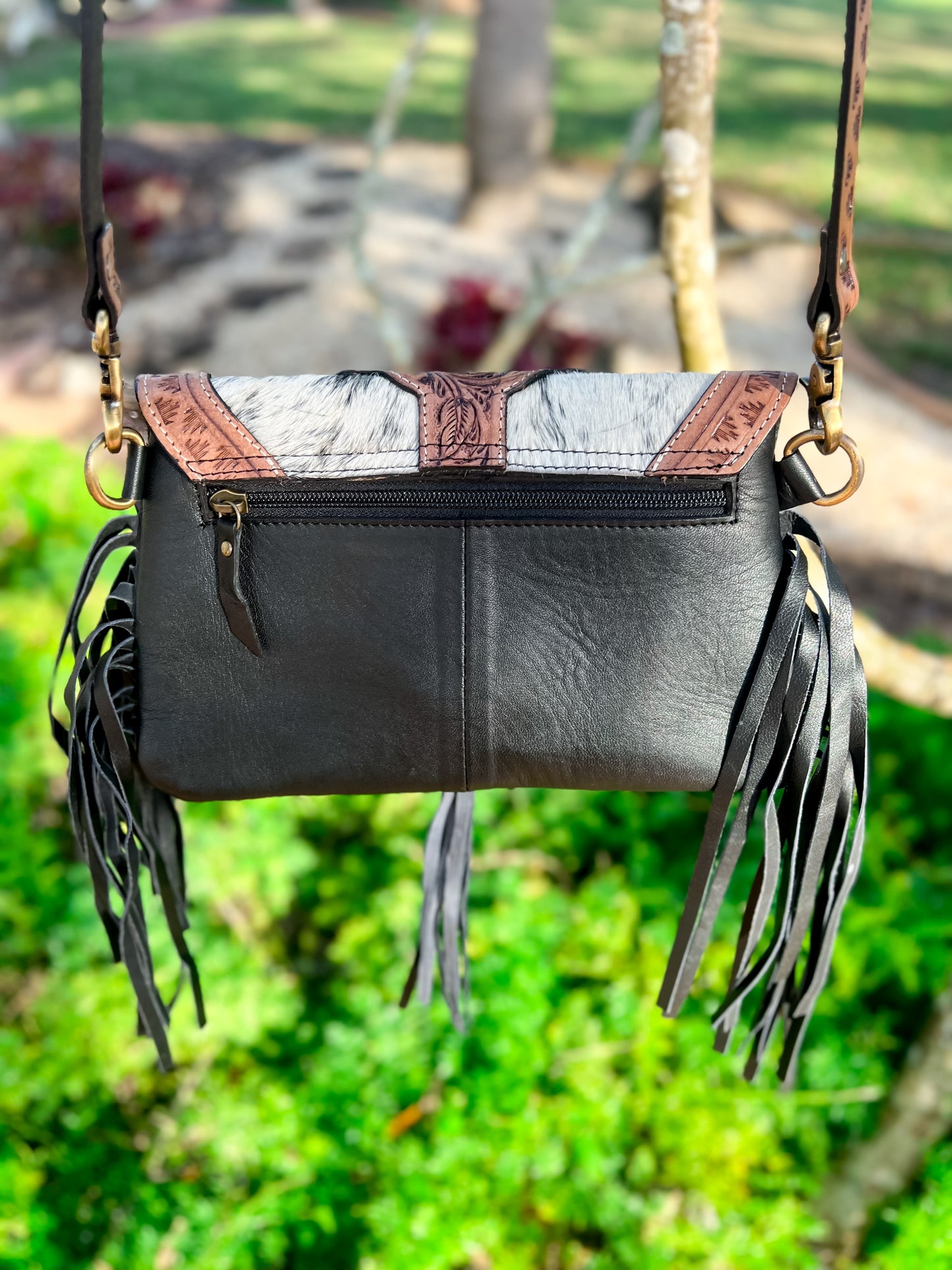 A touch of fringe front tooled cowhide crossbody