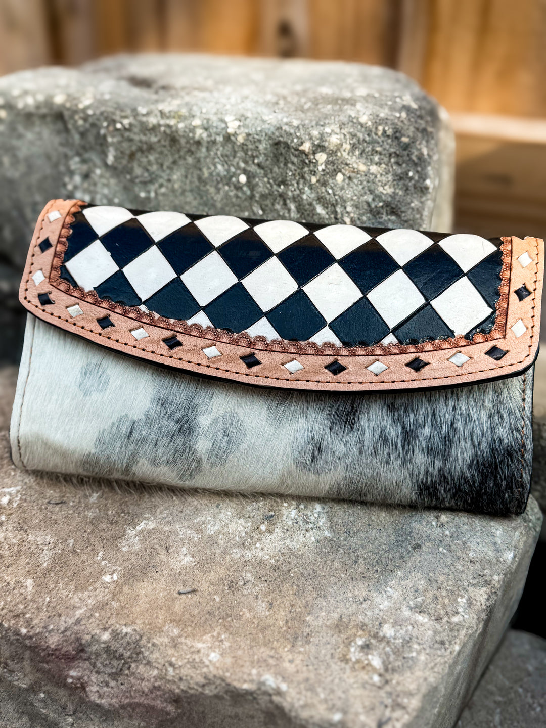 Speed Check black and ivory checkered leather flap wallet with genuine cowhide and tan leather trim.