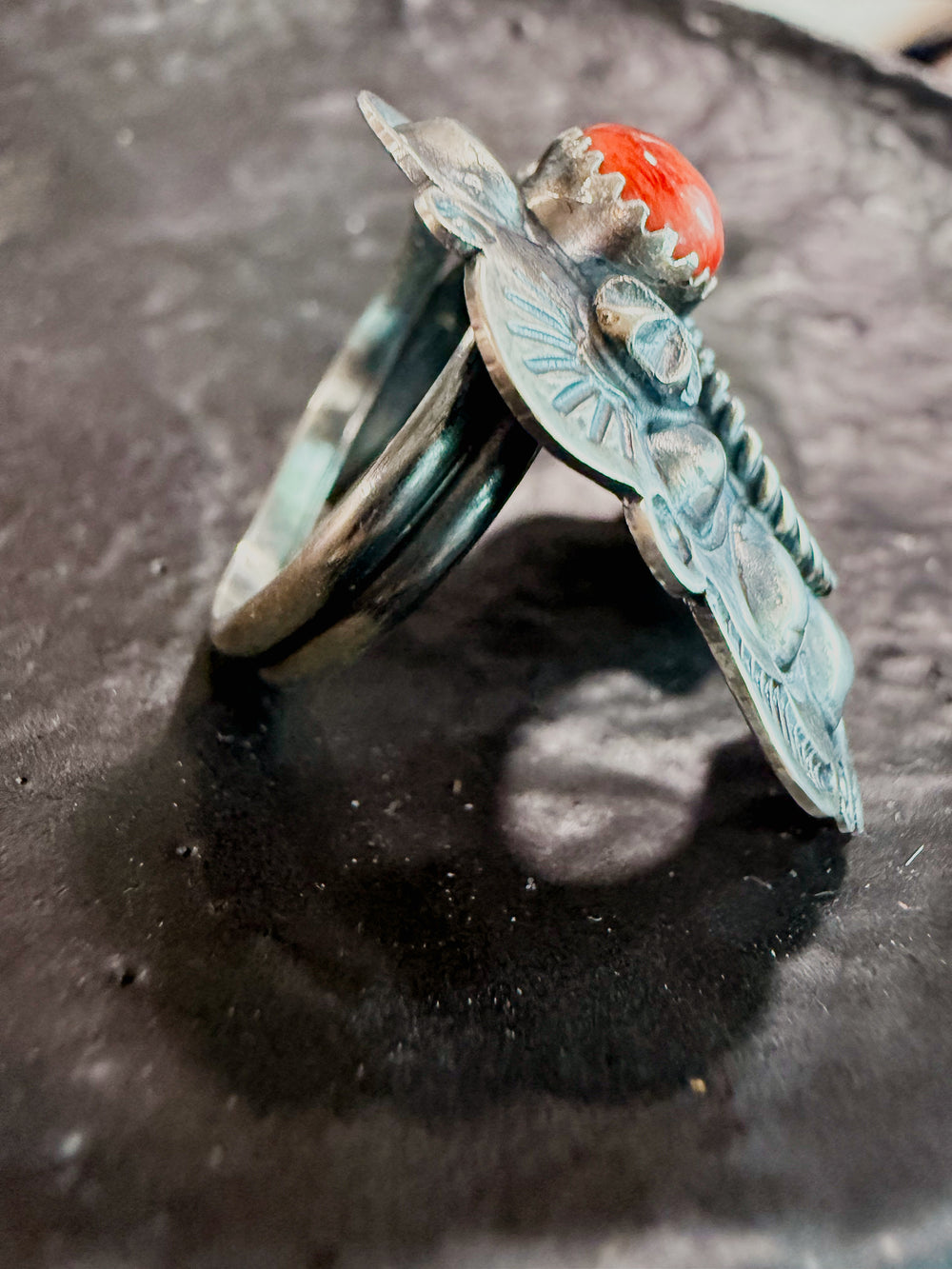 Side of handmade Navajo naja ring showing sterling silver craftsmanship and adjustable band