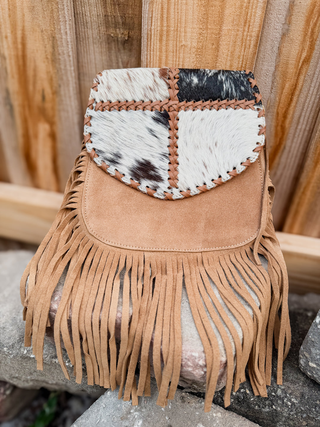 Beige tan suede fringe crossbody purse with patchwork cowhide flap and long fringe detail
