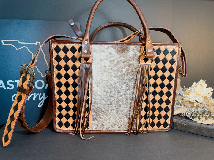 Cowhide and brown checkered full-grain leather tote from the Checkmate Collection.