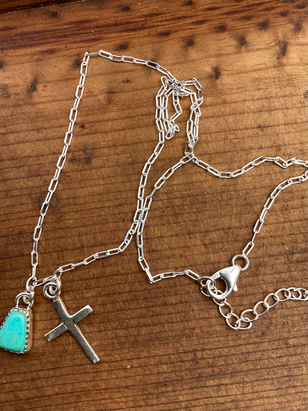 petite sterling silver cross and turquoise charm necklace with adjustable chain
