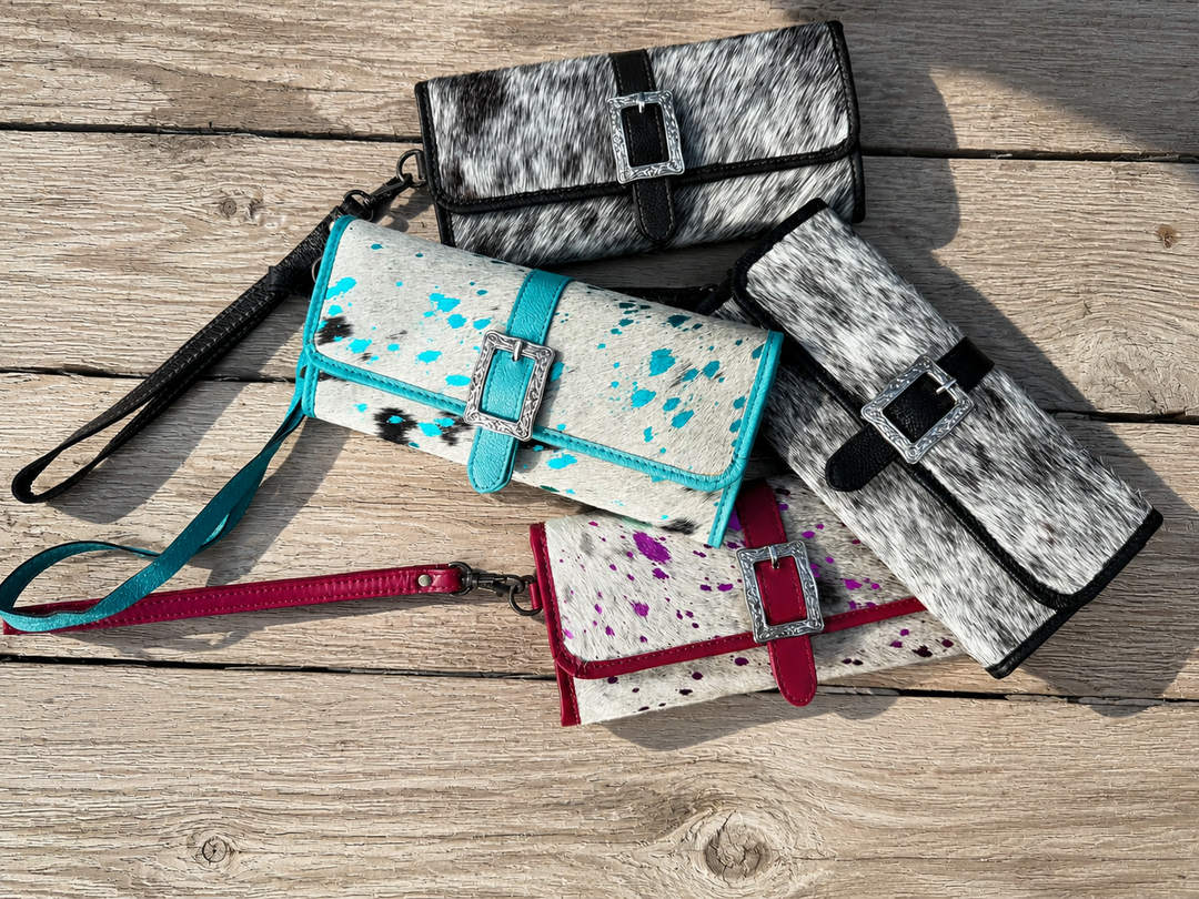 Genuine cowhide clutch wallets with decorative silver buckle, black turquoise or pink leather wristlet strap, magnetic closure, card slots, and phone storage.