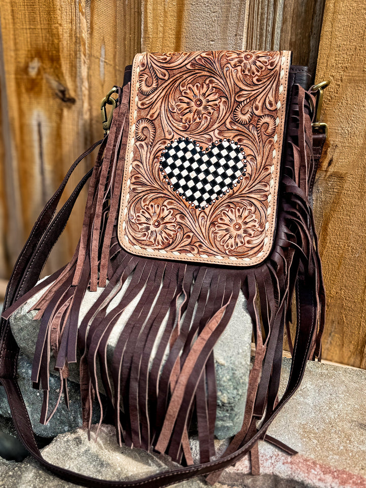 Brown fringe crossbody bag with tooled leather checkered heart flap and long fringe detail