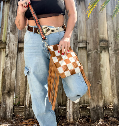 Cowhide checked fringe crossbody with black tooled strap