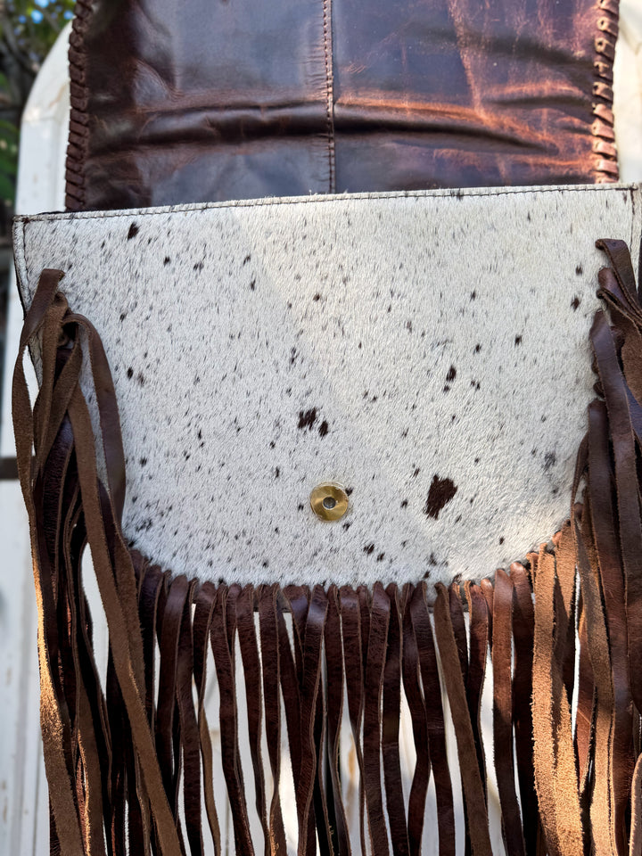 western fringe purse genuine leather cowhide handbag showing genuine hair on cowhide under flap closure 