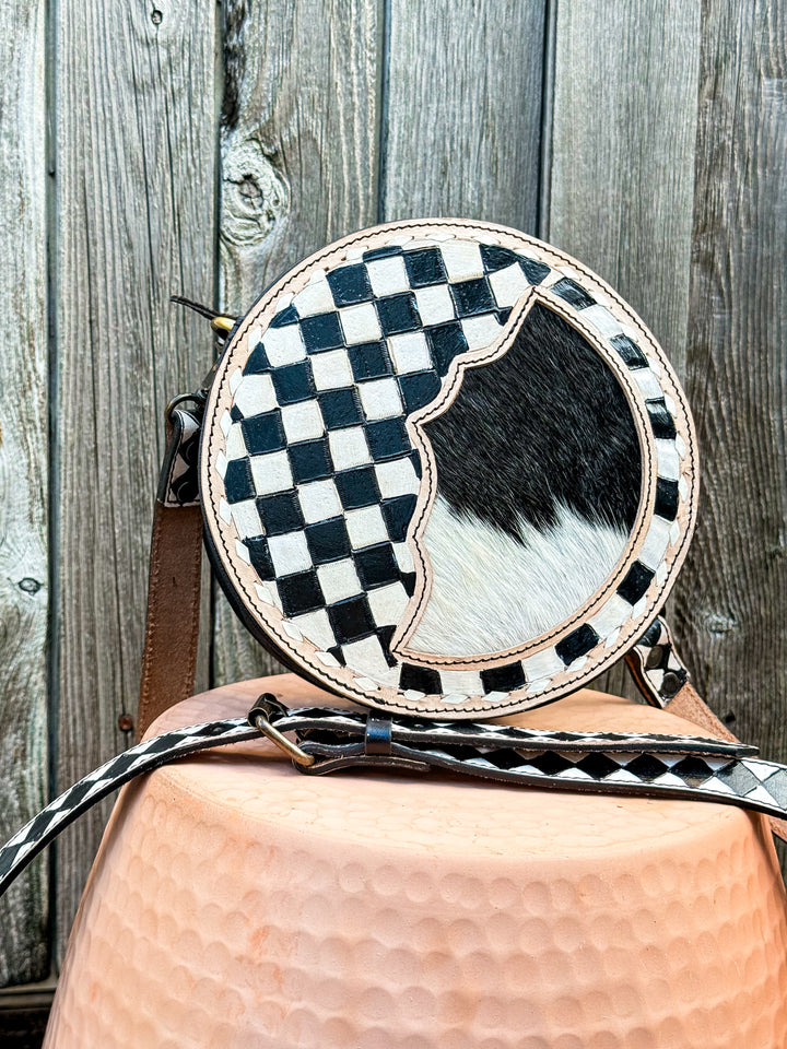 Speed Check canteen crossbody purse with black and white checkered trim and cowhide front