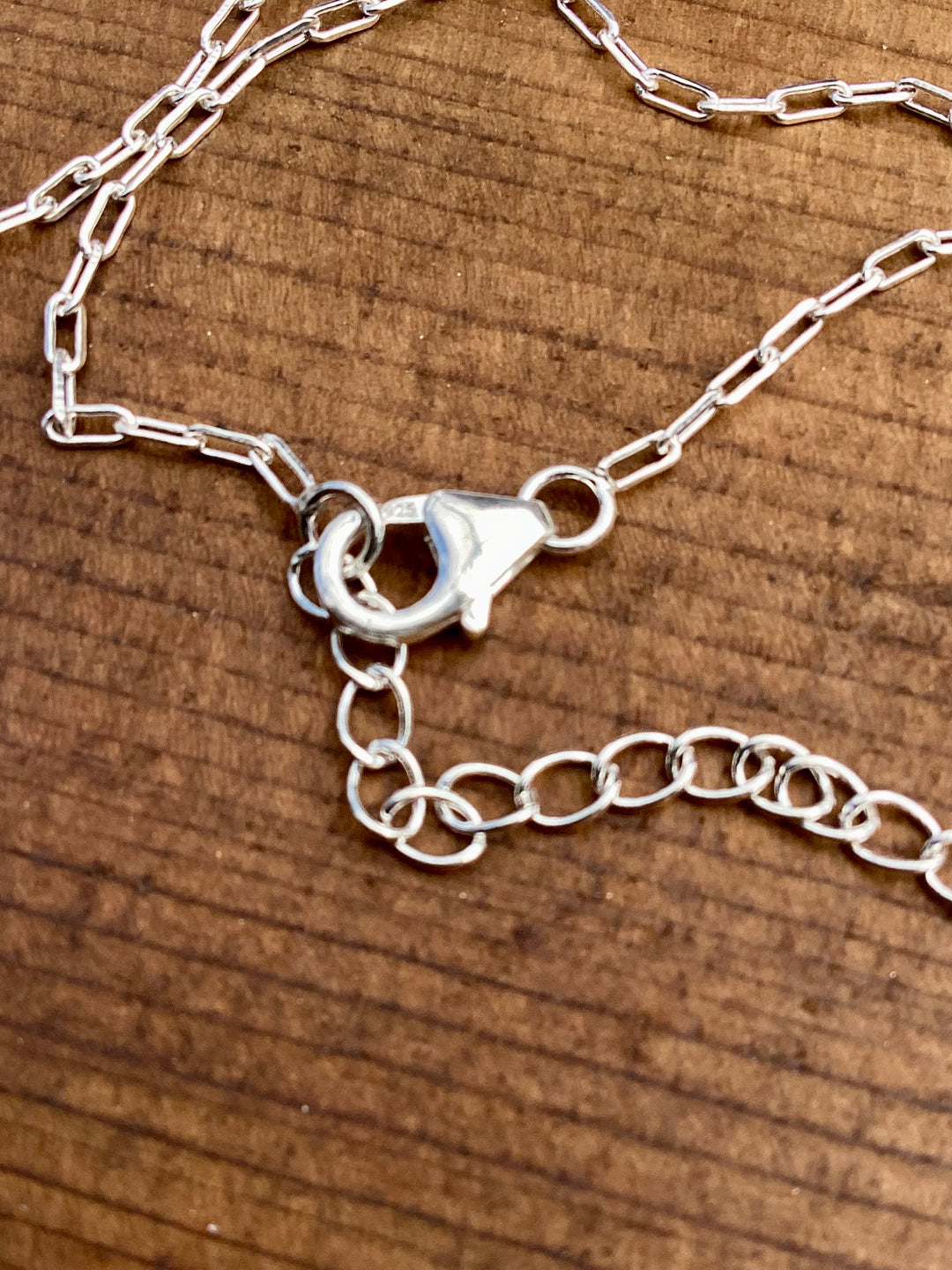 petite sterling silver cross and turquoise charm necklace with adjustable chain
