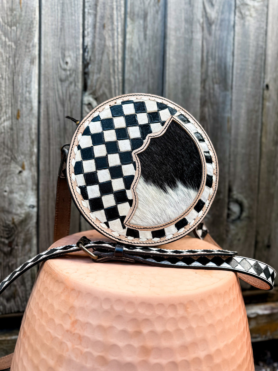 Speed Check canteen crossbody purse with black and white checkered trim and cowhide front