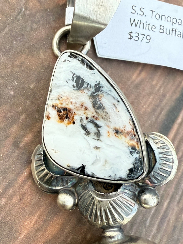 Close-up of White Buffalo turquoise stone in Navajo sterling silver pendant