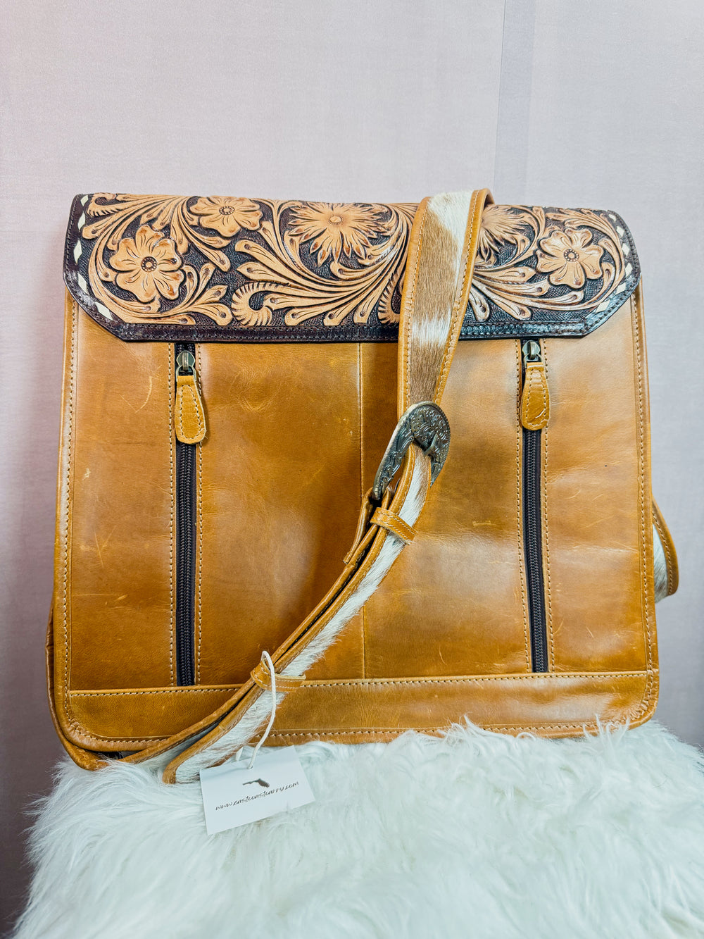 Brown leather women’s western work tote messenger bag with concealed carry double back zippers and cowhide strap with buckle detail from East Coast Carry