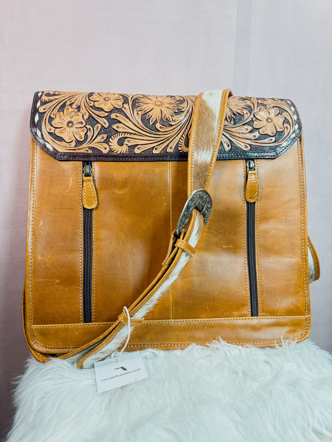 Brown leather women’s western work tote messenger bag with concealed carry double back zippers and cowhide strap with buckle detail from East Coast Carry