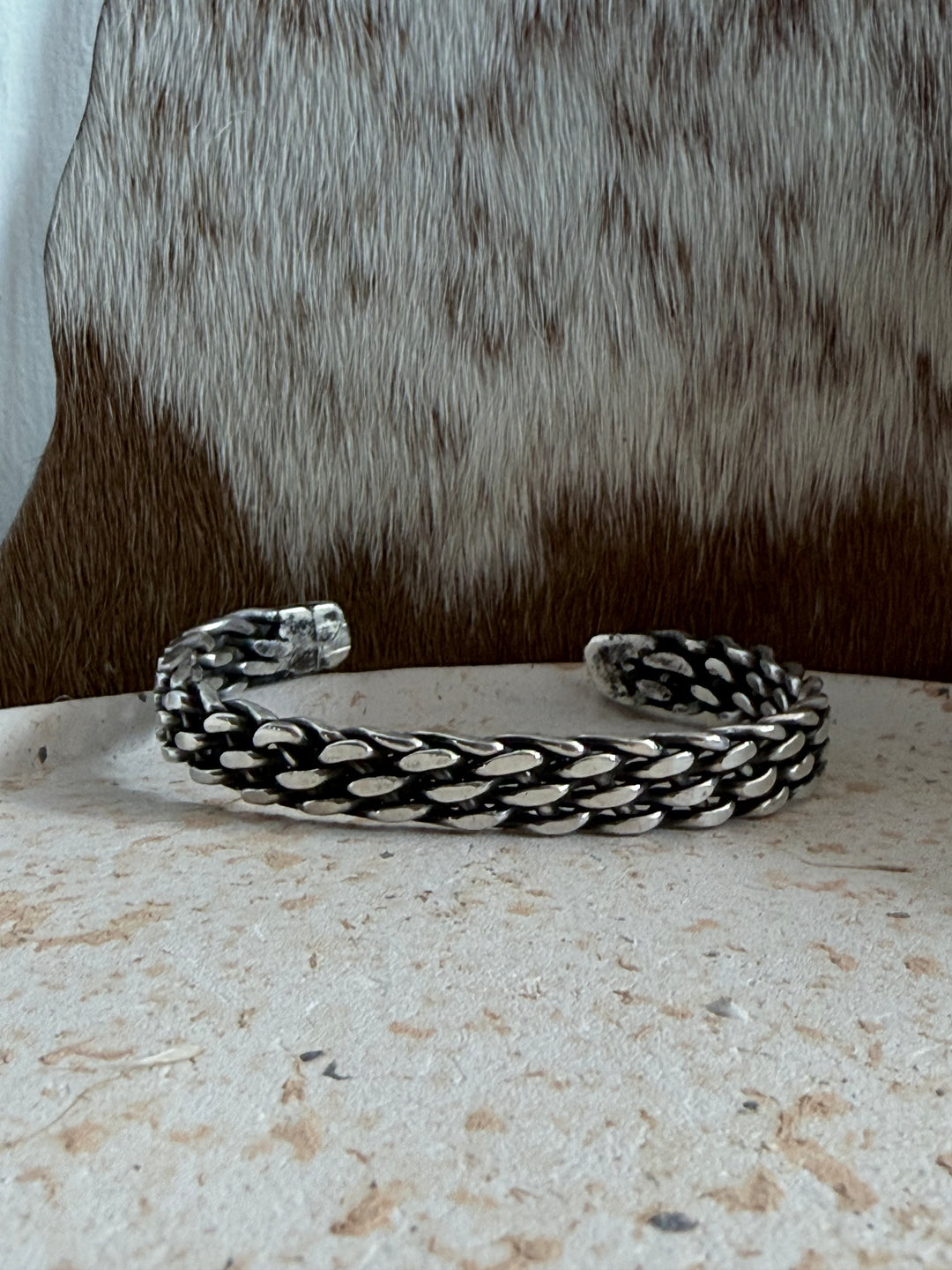 Navajo handmade sterling silver braided cuff bracelet by Tristan James with oxidized woven silver design