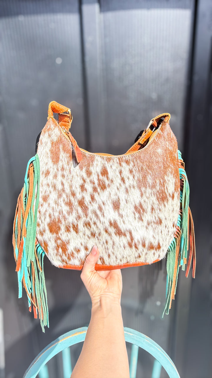 Brown and white speckled cowhide leather shoulder purse with turquoise and brown fringe
