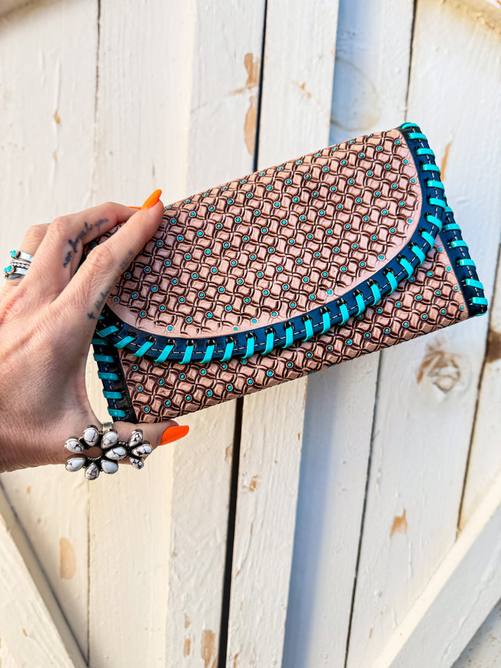 Slim leather phone wallet clutch with stamped pattern and whipstitch trim