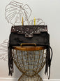 Fancy Seeing you Here: Tooled Brown Leather and Black Cowhide Hand Clutch