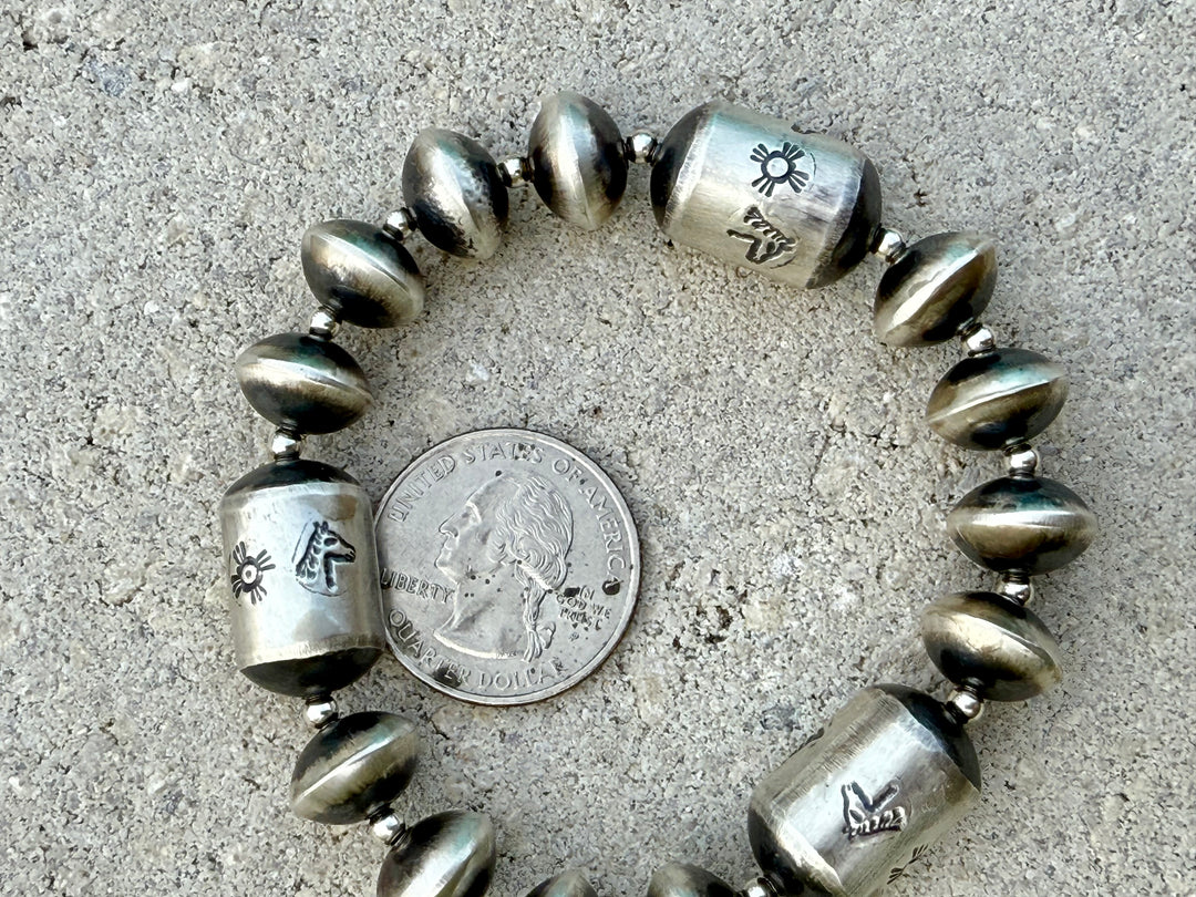 Handmade Navajo pearl sterling silver bracelet by Sharon Cooley Next to a Quarter for size Comparison 