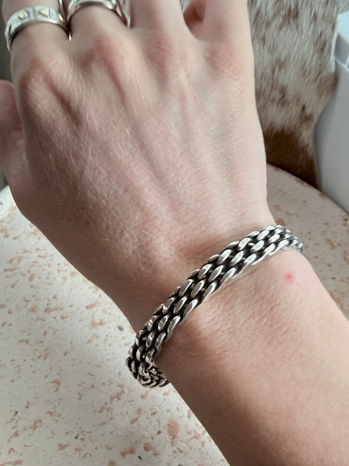 Navajo handmade sterling silver braided cuff bracelet by Tristan James with oxidized woven silver design