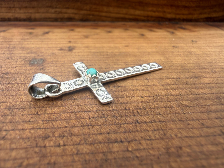 sterling silver cross pendant kingman turquoise southwestern style
turquoise cross necklace 925 silver western jewelry
minimal silver cross turquoise center stone