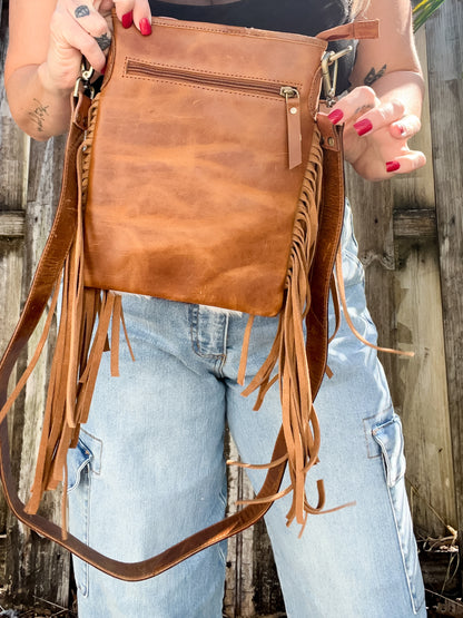 Cowhide checked fringe crossbody with black tooled strap