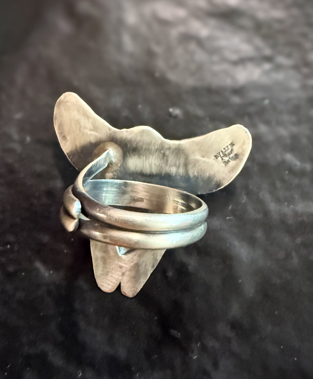 Back of handmade Navajo sterling silver ring showing artisan craftsmanship and band