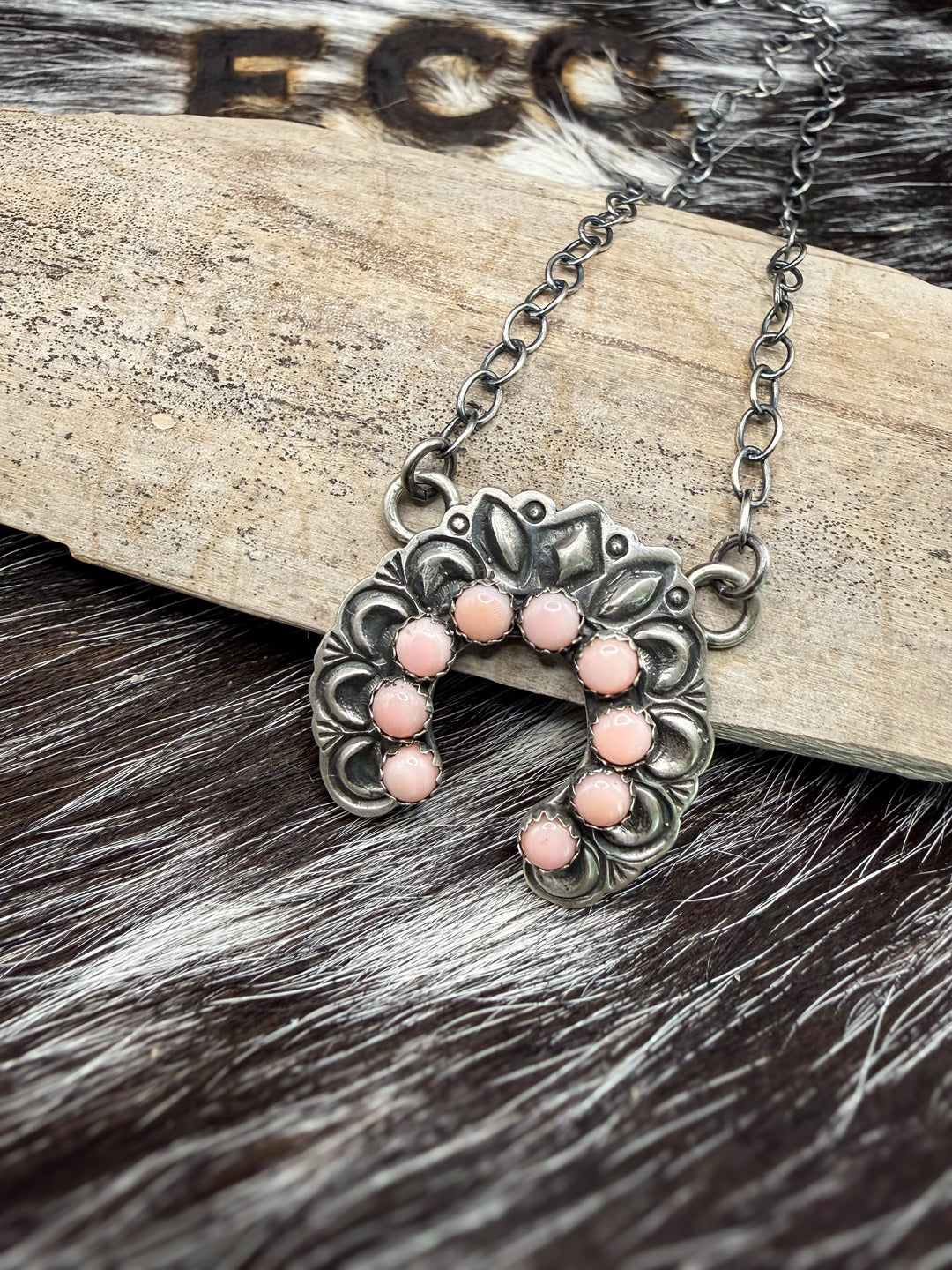 Handmade Navajo sterling silver naja necklace with pink conch stones signed by Native American artist R Livingston