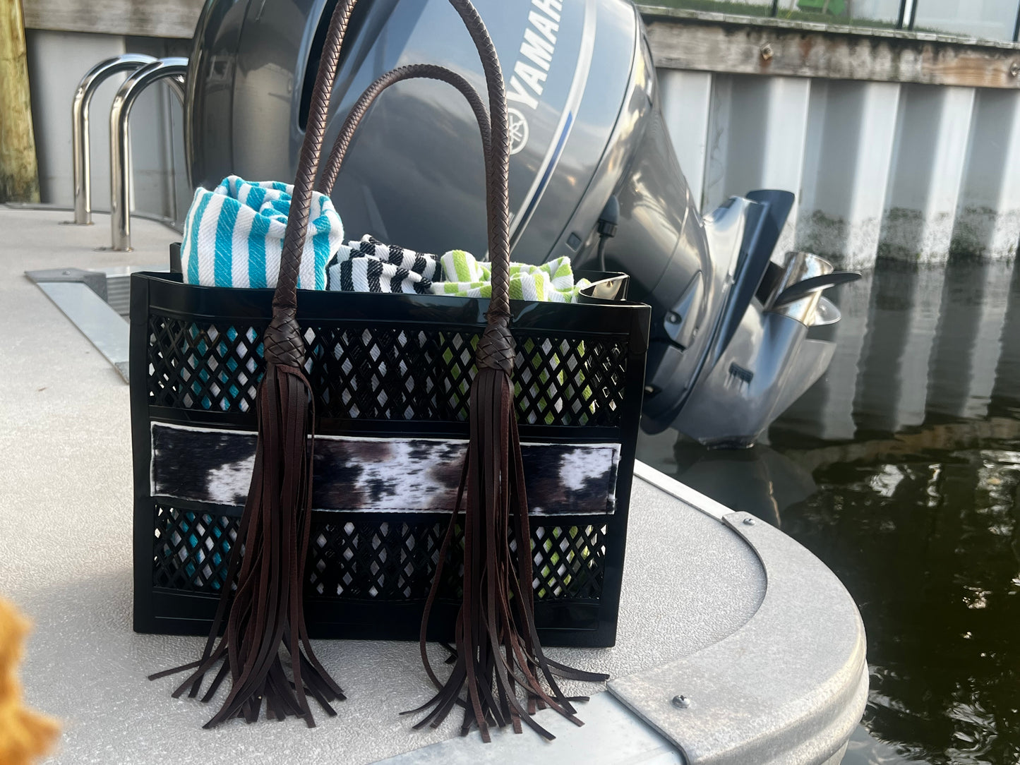The Coastal Cowgirl - Western PVC Beach Bag with Cowprint Detail and Hand Braided Fringe Handles