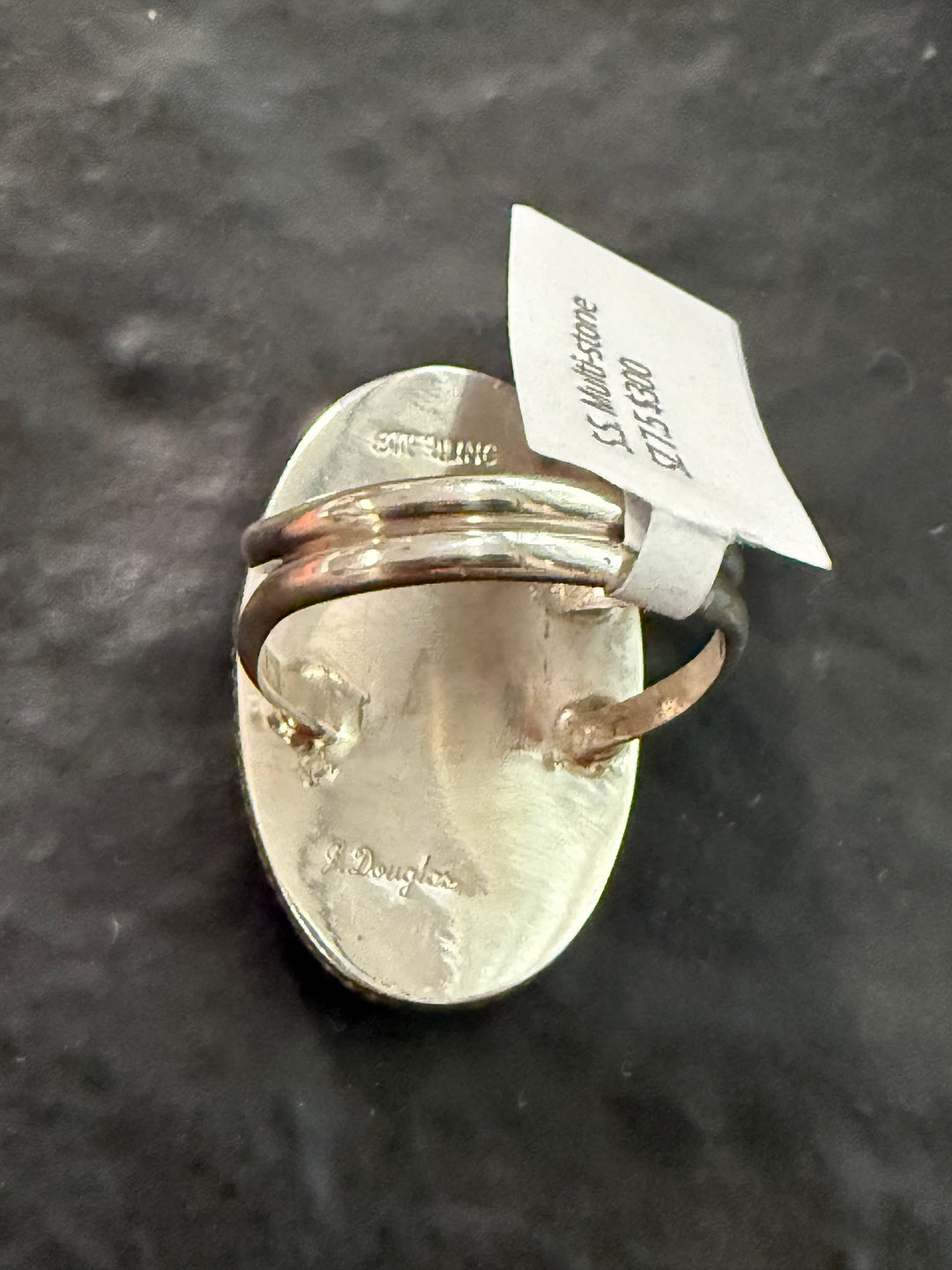 Back of Navajo handmade inlay ring signed Joanne Douglas sterling
