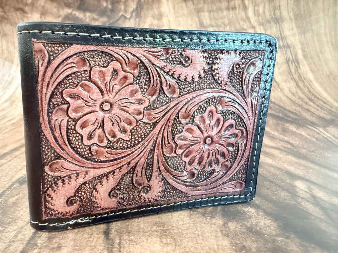 Front view of men’s tooled leather wallet with floral scroll design