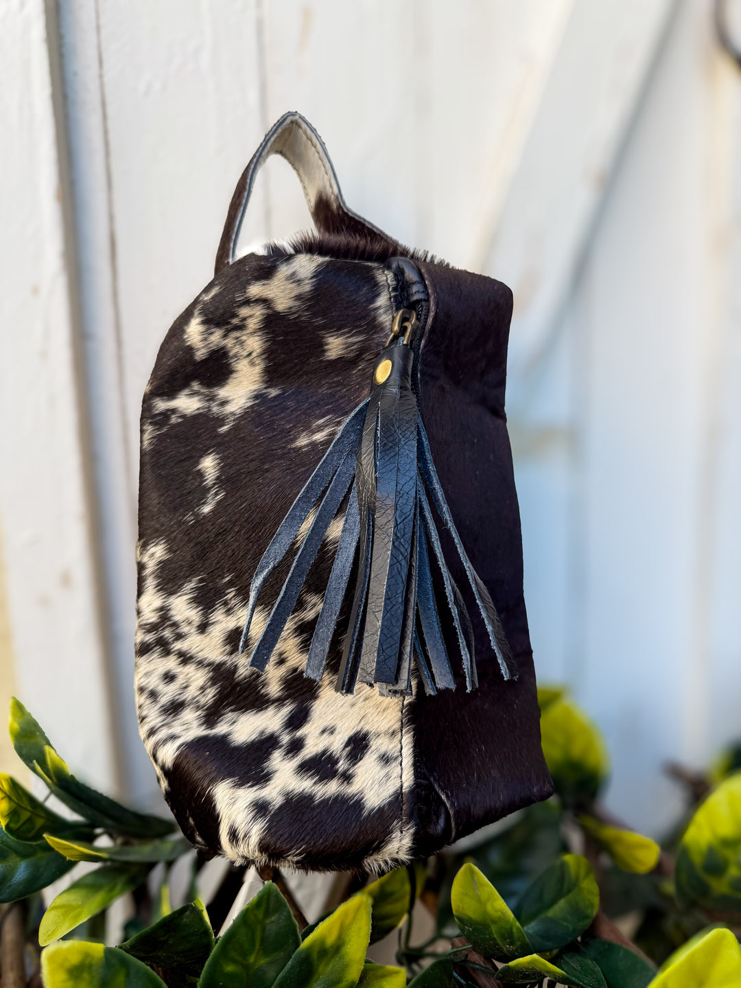 Black and white hair on cowhide genuine leather cosmetic toiletry bag with black leather tassel on zipper closure