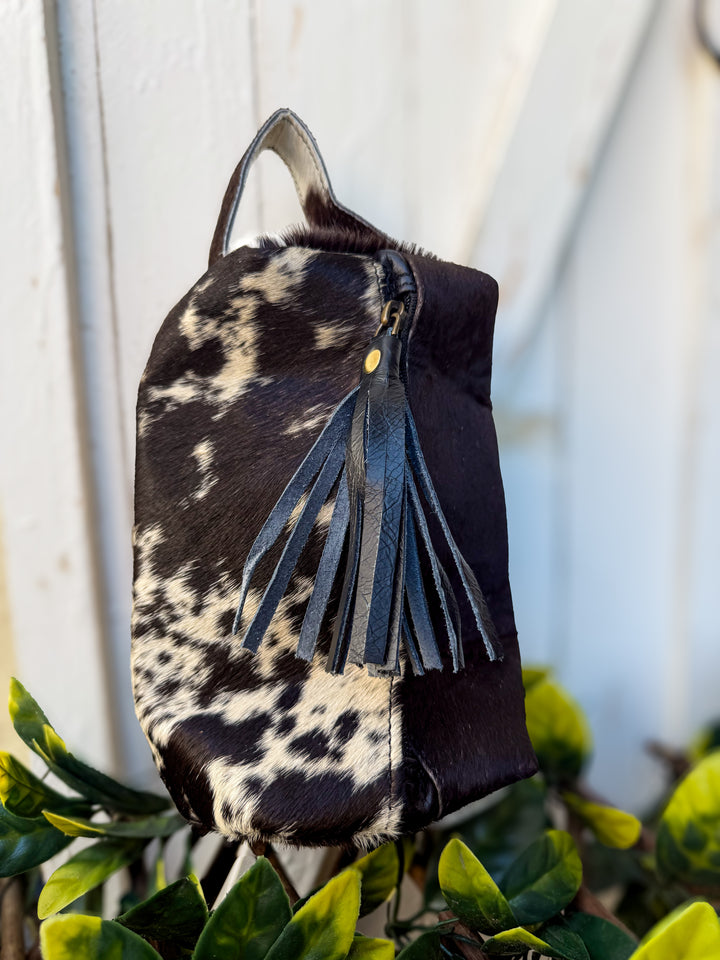 Black and white hair on cowhide genuine leather cosmetic toiletry bag with black leather tassel on zipper closure