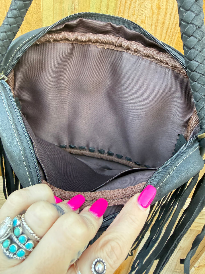 Interior view of Donna Jean cowhide fringe bag with pocket
